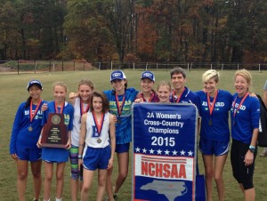 The 2015 BHS Women's Cross Country team at State with their trophy.